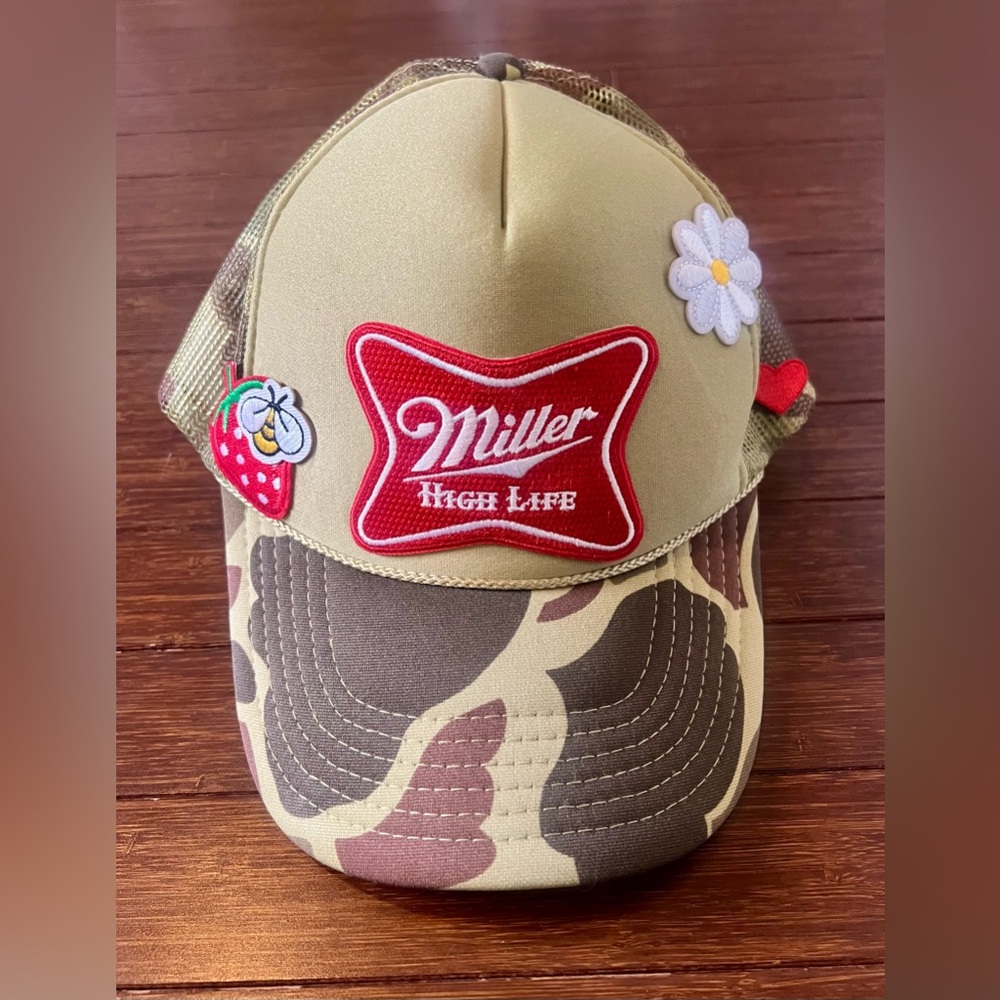 camouflage-patterned Miller High Life trucker hat featuring embroidered patches. - Picture 1 of 5